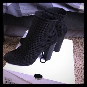 They are black neoprene Aldo booties